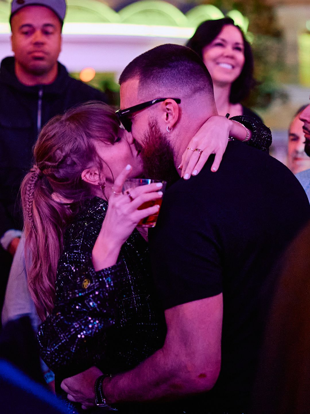Taylor Swift and Travis Kelce Share Celebratory Kiss inside DJ Booth at XS Nightclub inside Wynn Las Vegas on Feb. 11 after the Kansas City Chiefs' Super Bowl win