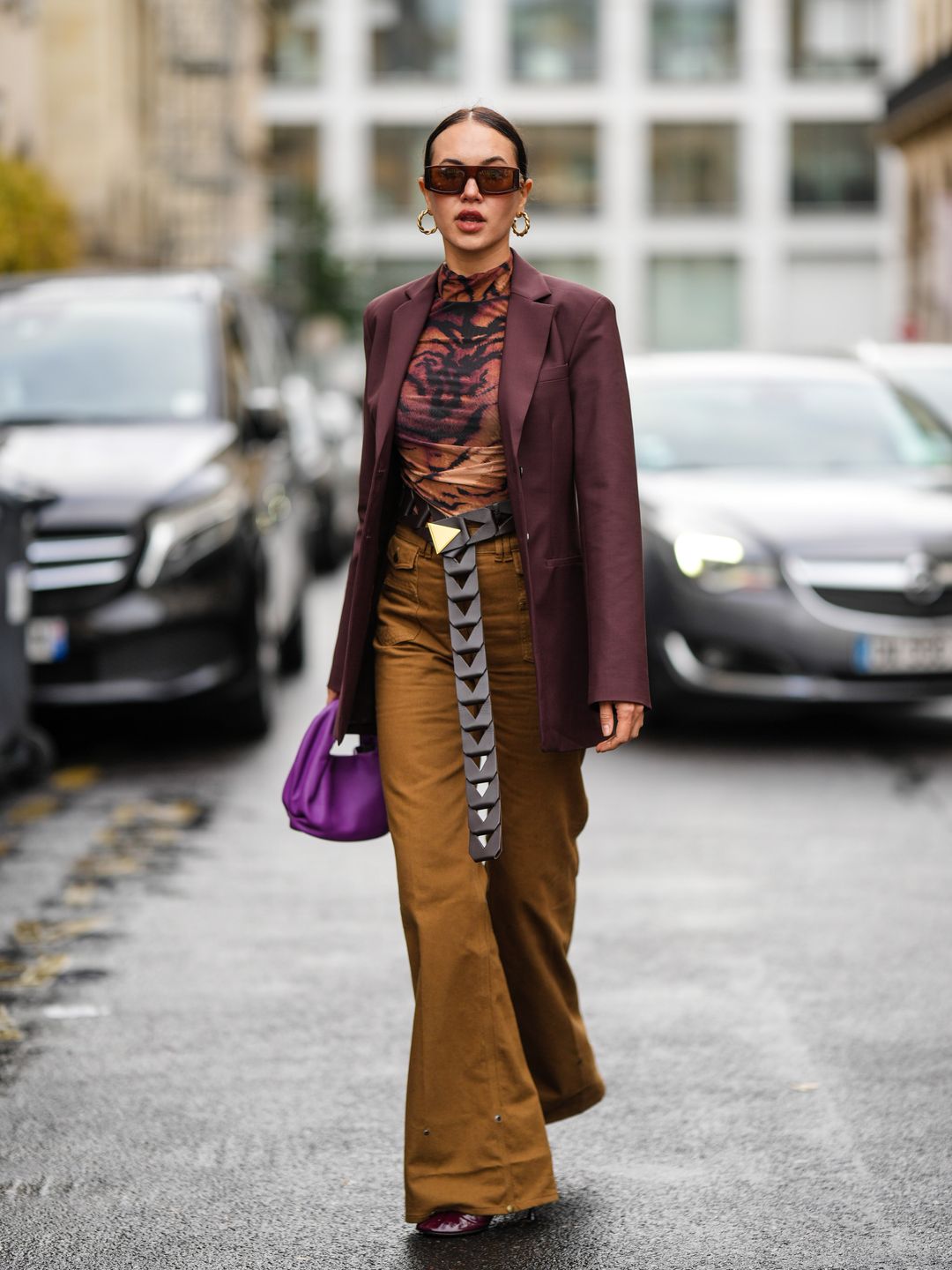 A stylish guest wearing a patterned turtleneck at Paris Fashion Week SS23 