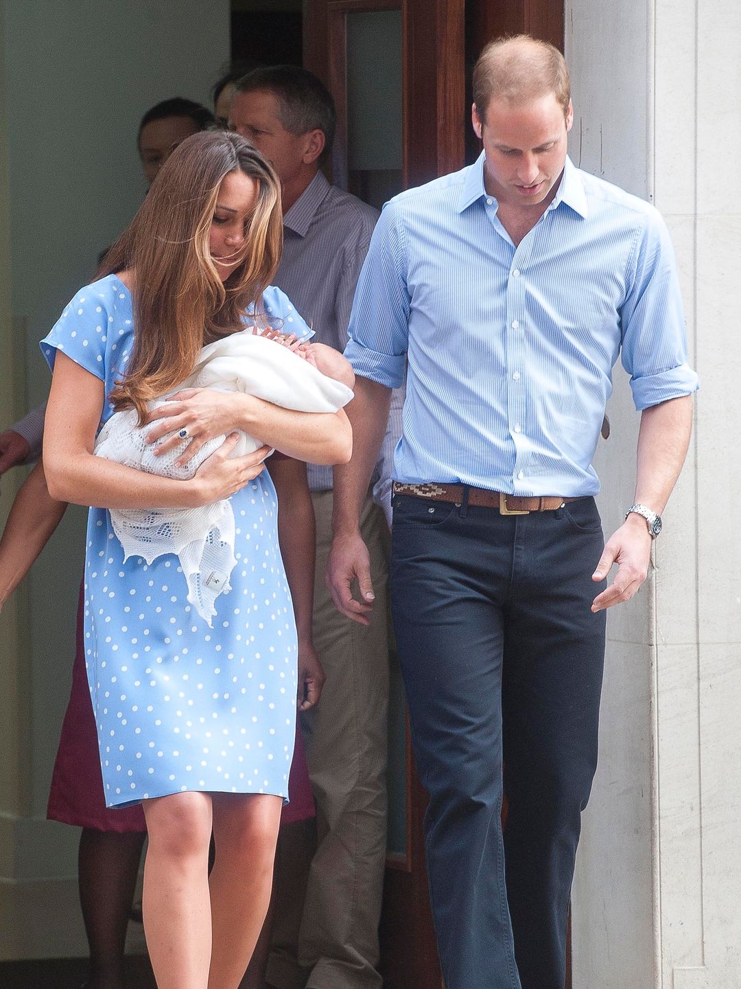 Kate Middleton carrying a baby Prince George and walking with Prince William