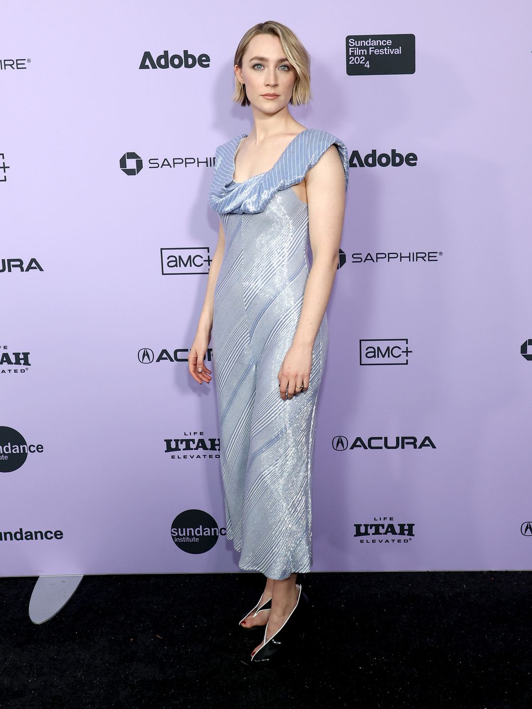 Saoirse Ronan attends "The Outrun" Premiere during the 2024 Sundance Film Festival wearing a baby blue sequin jumpsuit and heels