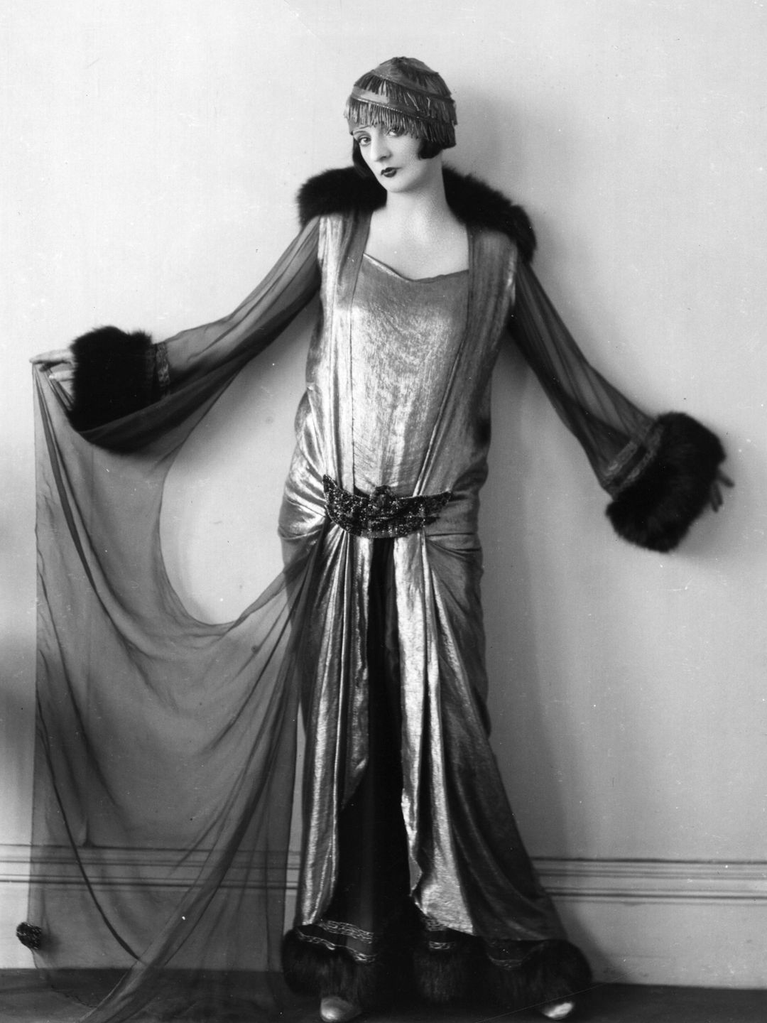 English actress Elsie Randolph dressed in stunning eveningwear designed by Norman Hartnell.