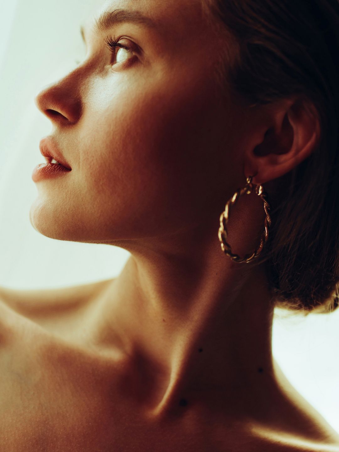 Profile view of beautiful woman with earring