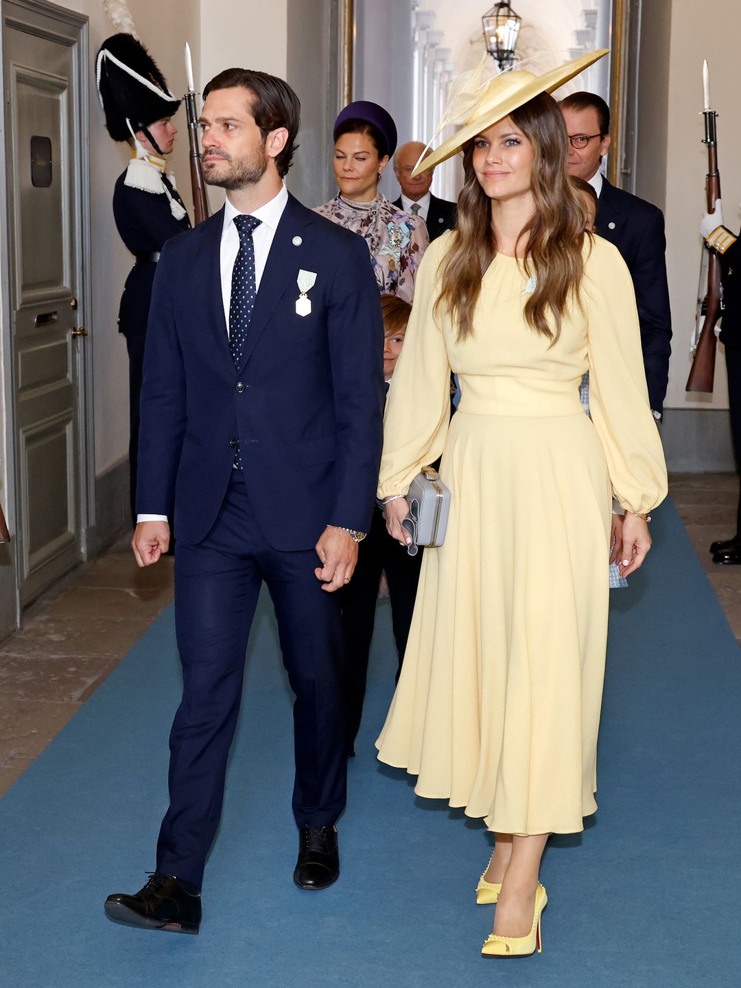 Prince Carl Phillip of Sweden and Princess Sofia of Sweden arrive for the Te Deum during the celebration of the 50th coronation anniversary of King Carl Gustav of Sweden. Sofia wears an all-yellow dress