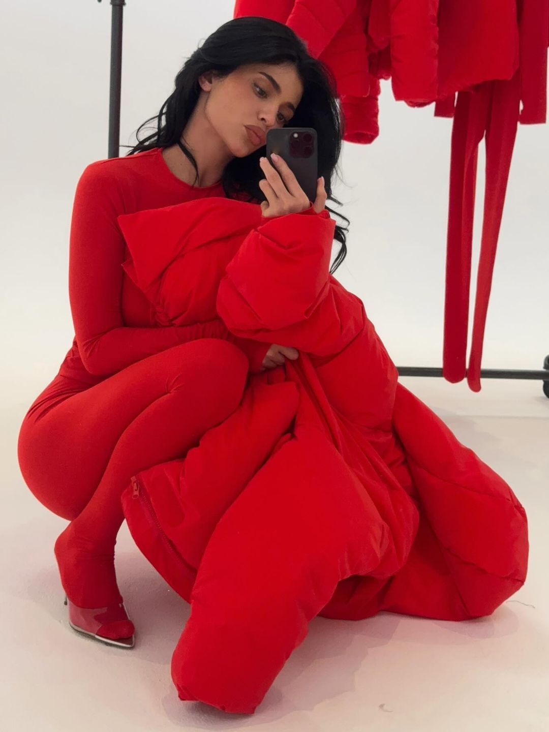 Kylie Jenner poses for a mirror selfie in an all-red outfit