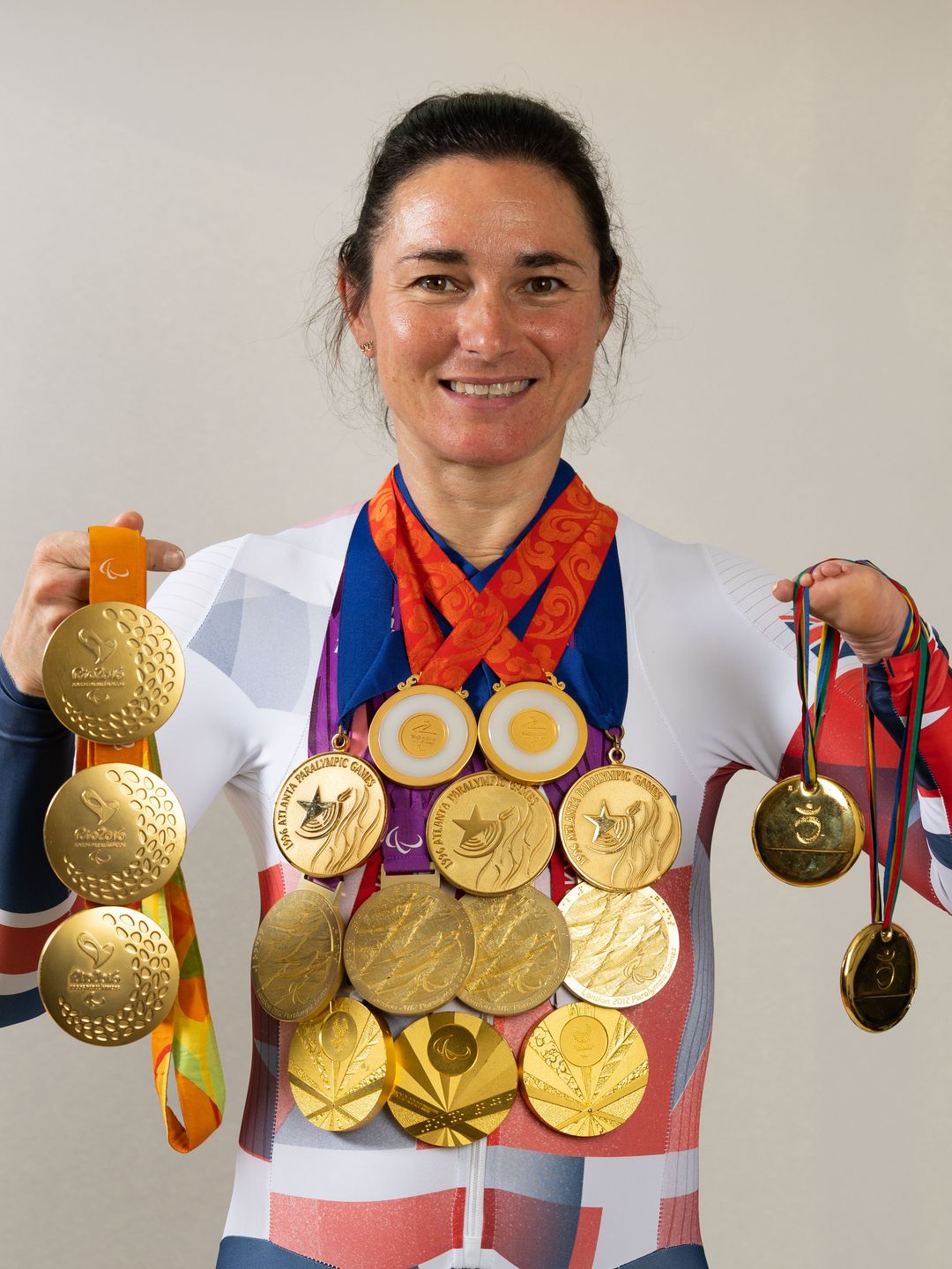 Dame Sarah Storey poses with her 17 Paralympic gold medals on June 16, 2024 in Disley, England