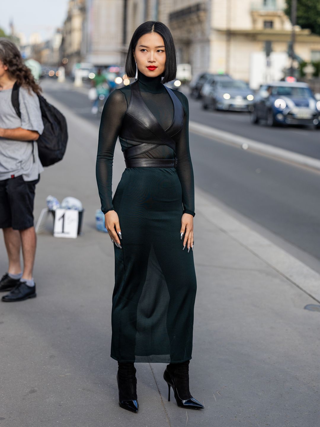 A guest wore a semi-sheer dress alongside a leather wraparound crop top.