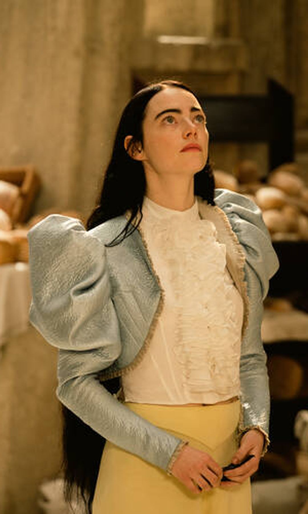 Emma stone in poor things and blue blouse