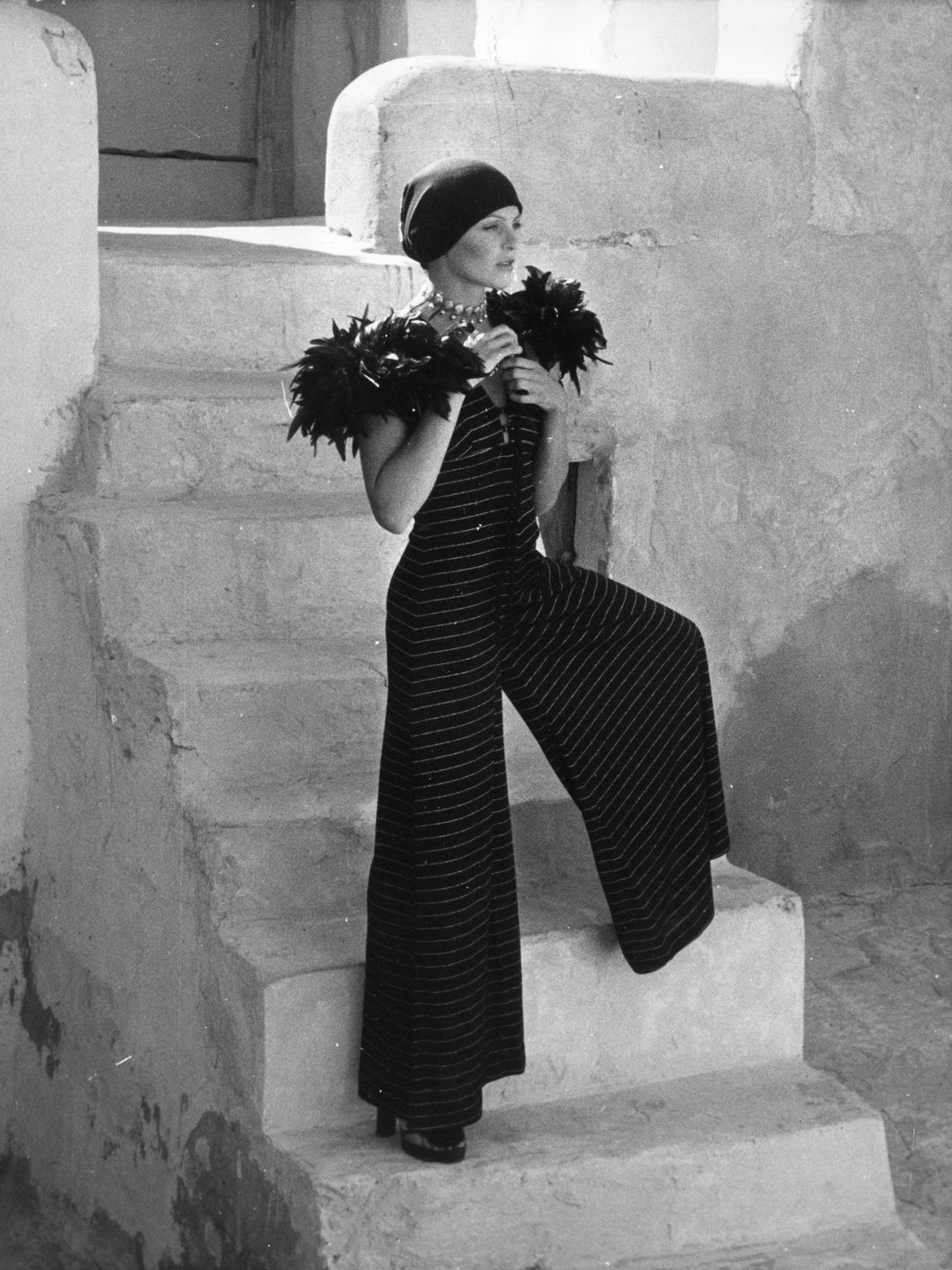 A fashion model wearing an all-in-one jumpsuit designed by Fernand Ledoux