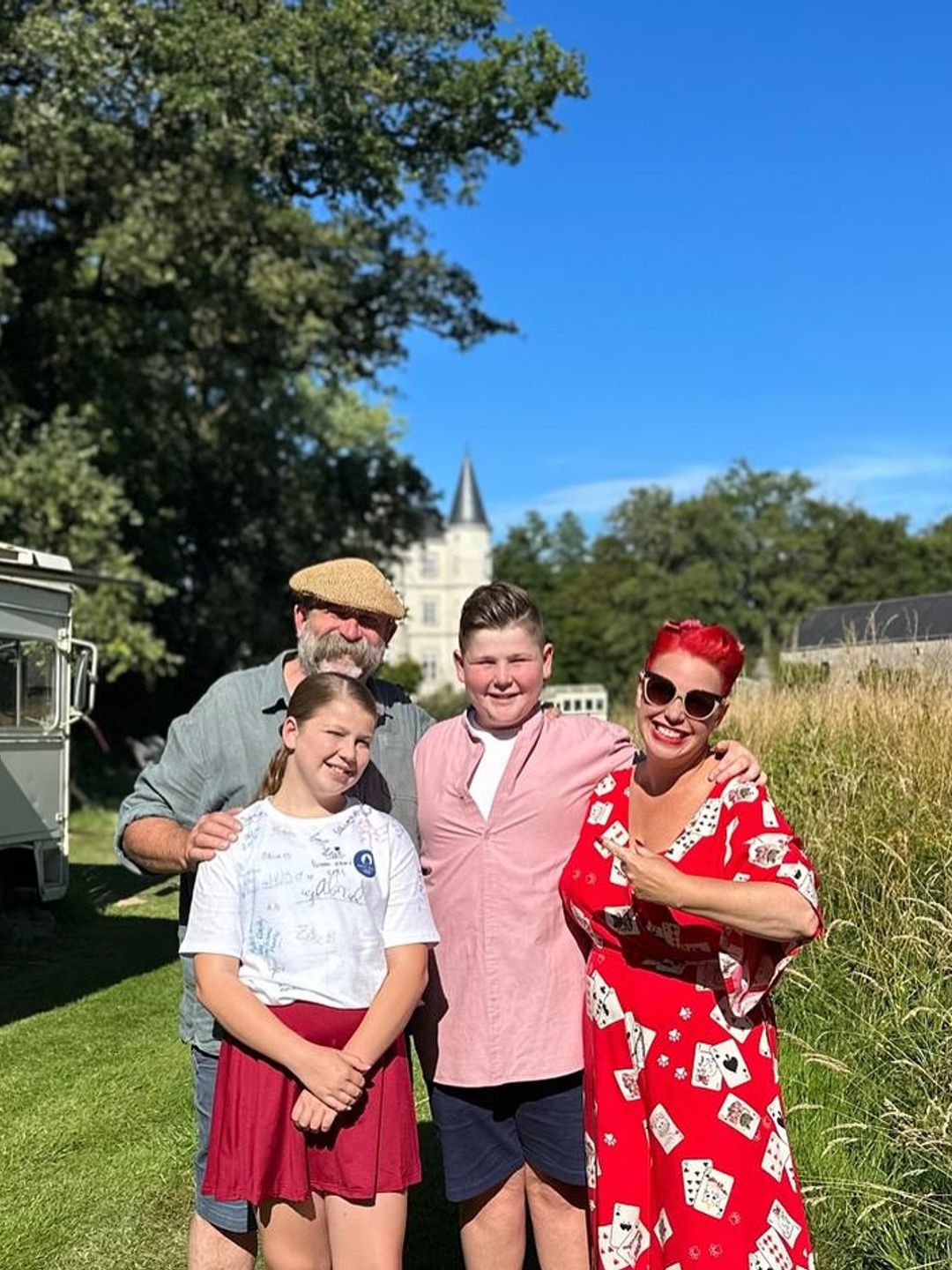 family-of-four posing on lawn