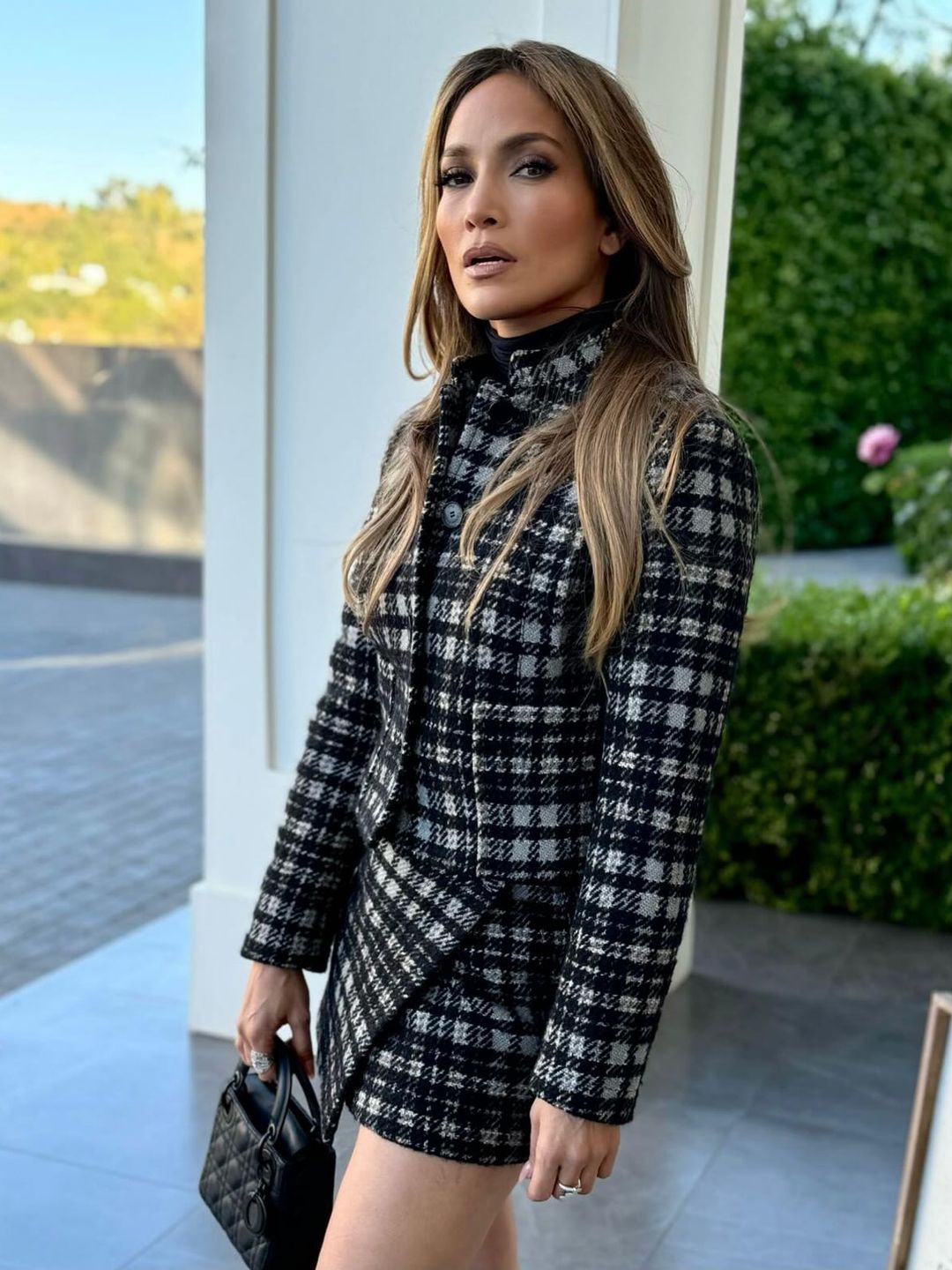 Jennifer Lopez poses for a picture in a tweed co-ord