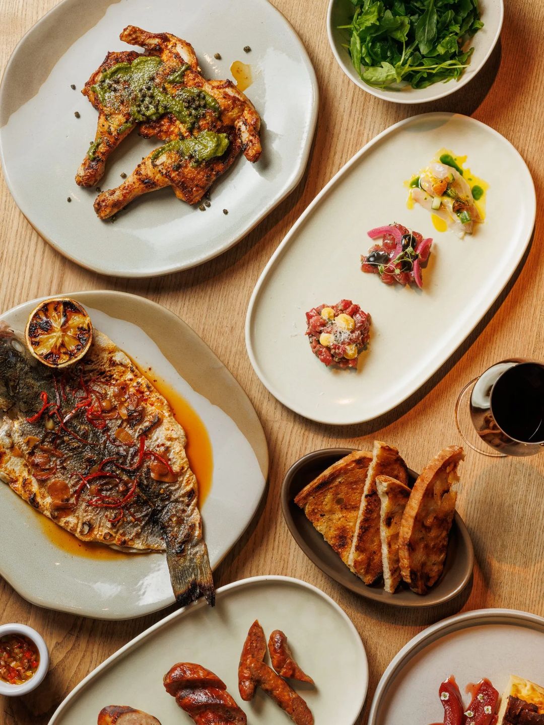 Beautifully arranged table featuring a variety of dishes that showcase vibrant flavors and rich textures.