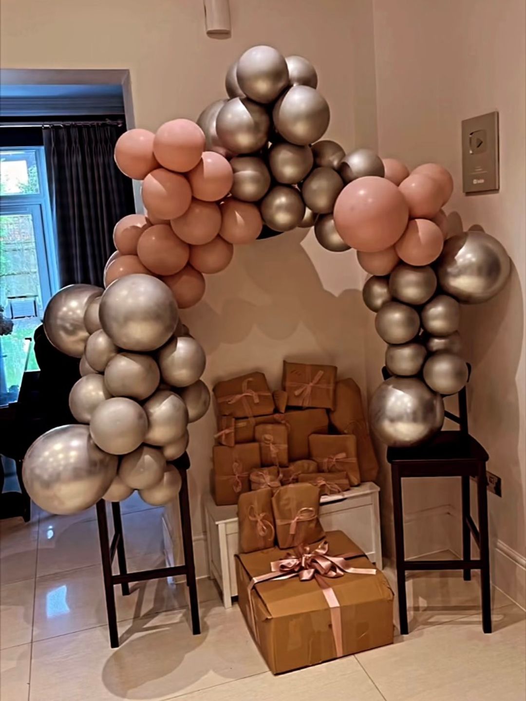 Millie's presents surrounded by a balloon arch