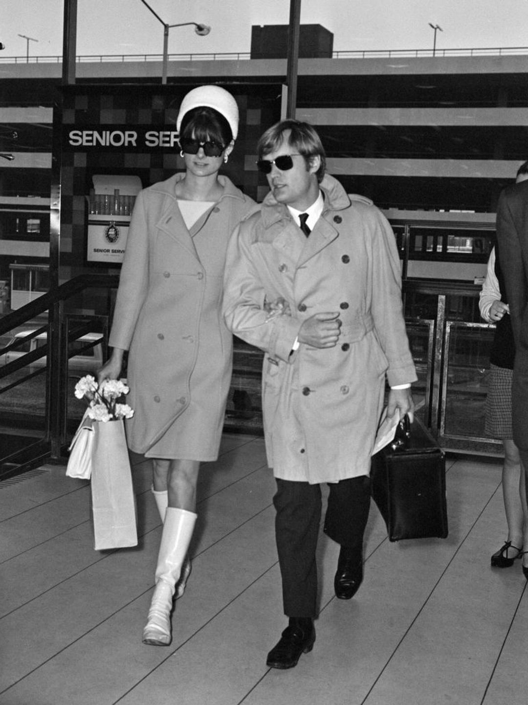 Actor David McCallum, one of the stars of the TV show 'The Man from U.N.C.L.E.' leaving Heathrow Airport for New York with his wife Katherine Carpenter, 18th January 1968