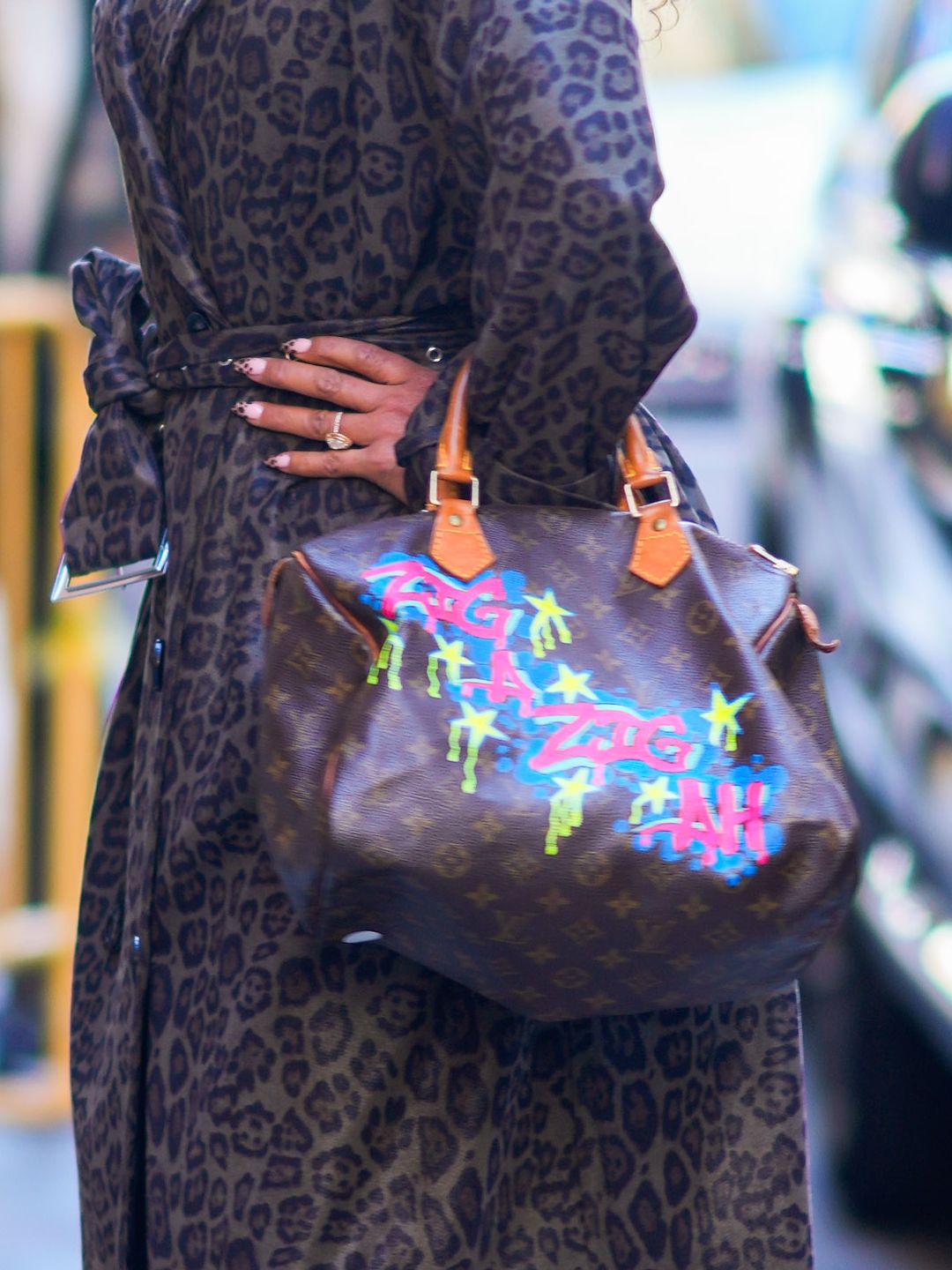  A close up of Mel B's Louis Vuitton bag and leopard print manicure 