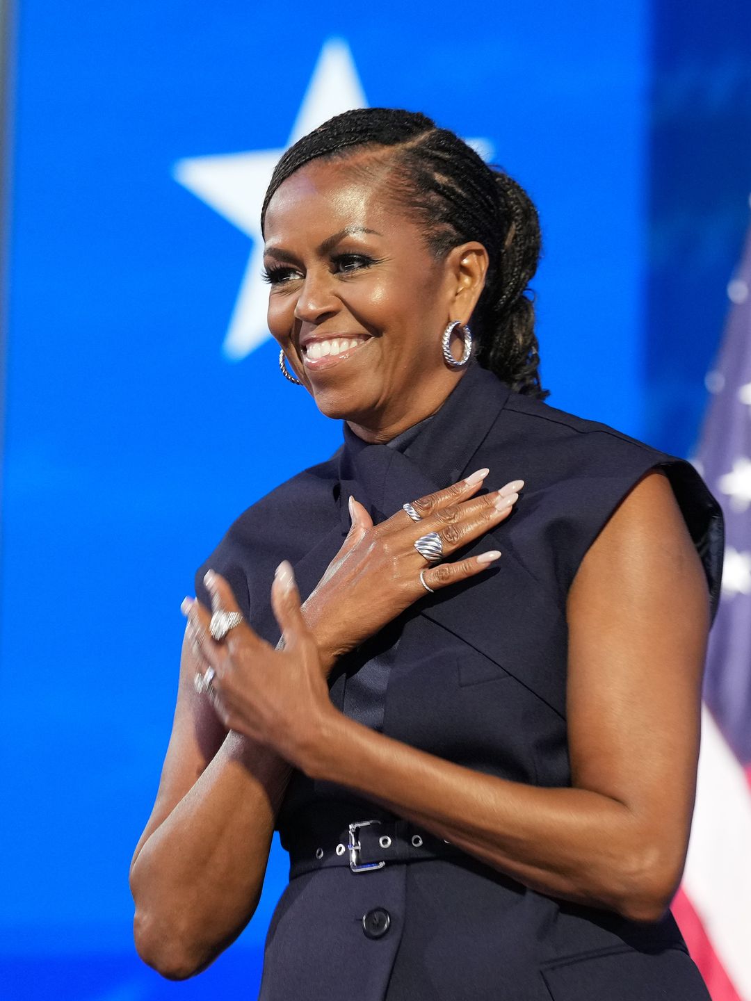 Former first lady Michelle Obama arrives to speak on stage during the second day of the Democratic National Convention at the United Center on August 20, 2024 in Chicago