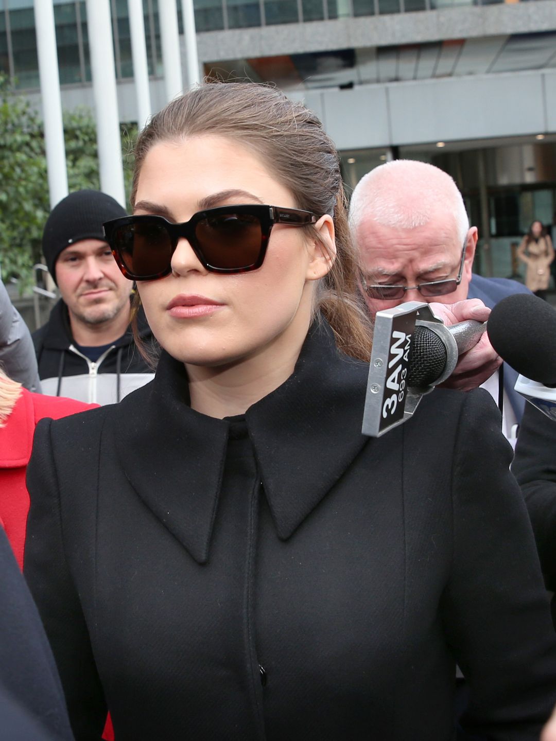 Belle Gibson (centre) leaves the Federal Court in Melbourne, Thursday, June 20, 2019