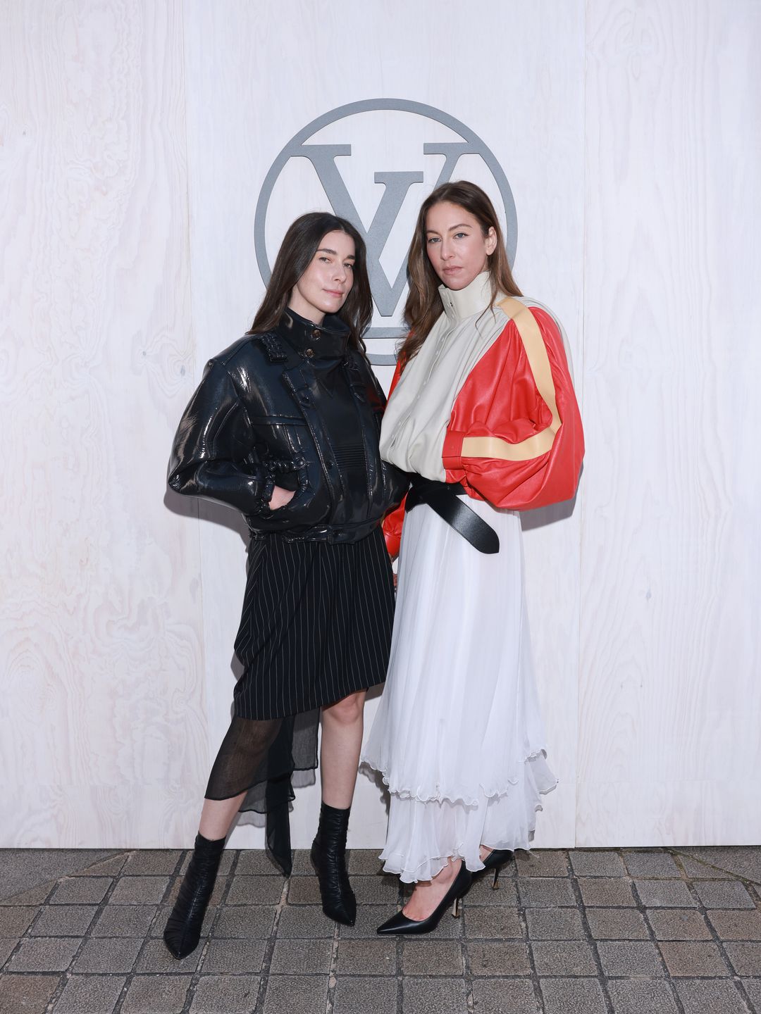 anielle Haim and Este Haim attend the Louis Vuitton Womenswear Fall/Winter 2024-2025
