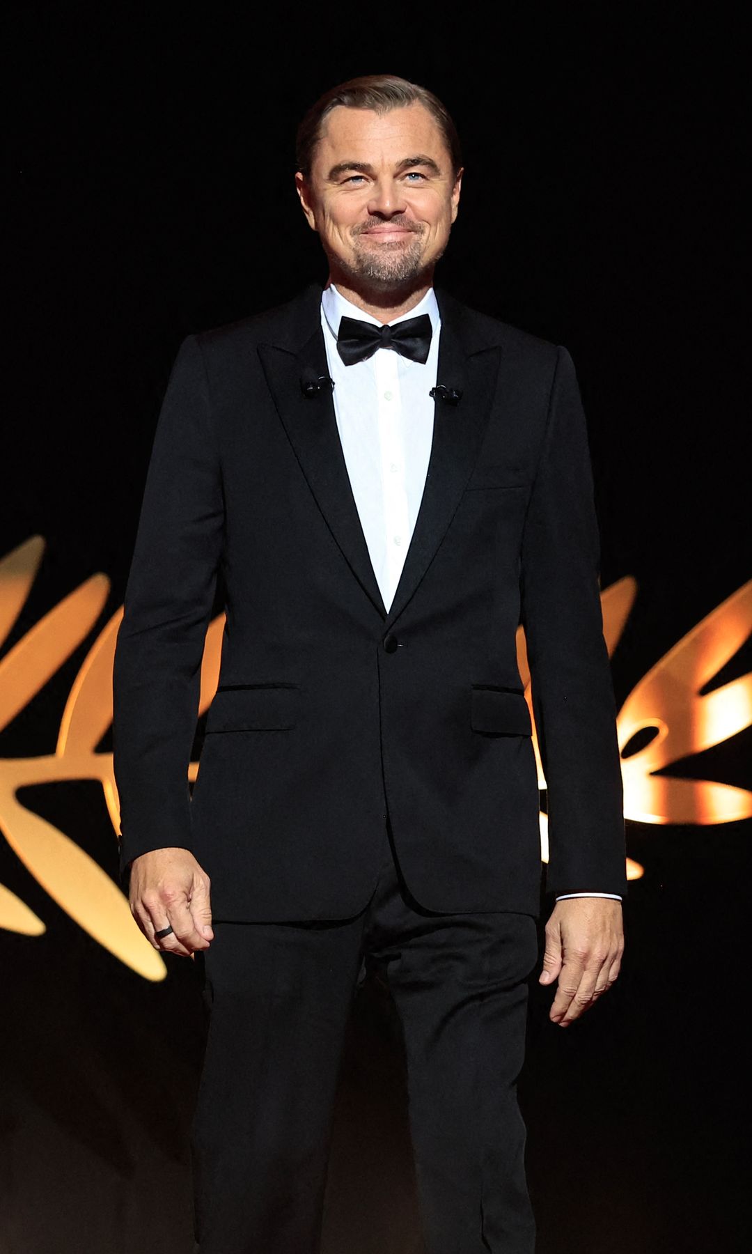 Leonardi DiCaprio in a black tuxedo