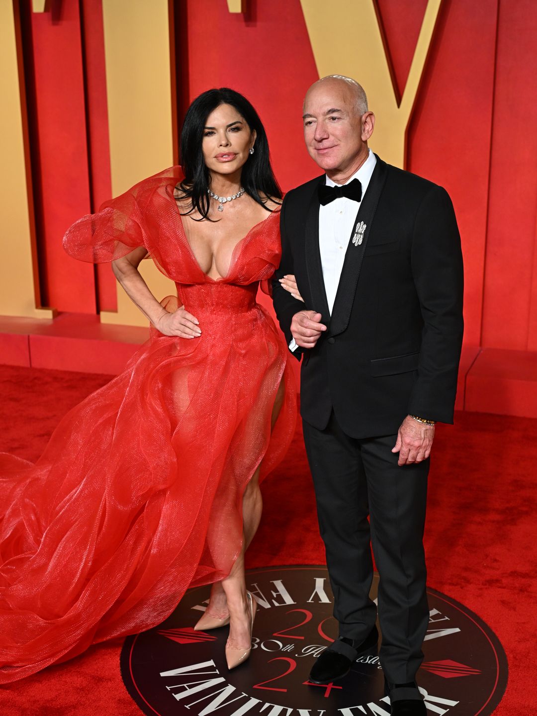 Lauren Sanchez and Jeff Bezos attending the Vanity Fair Oscar Party 