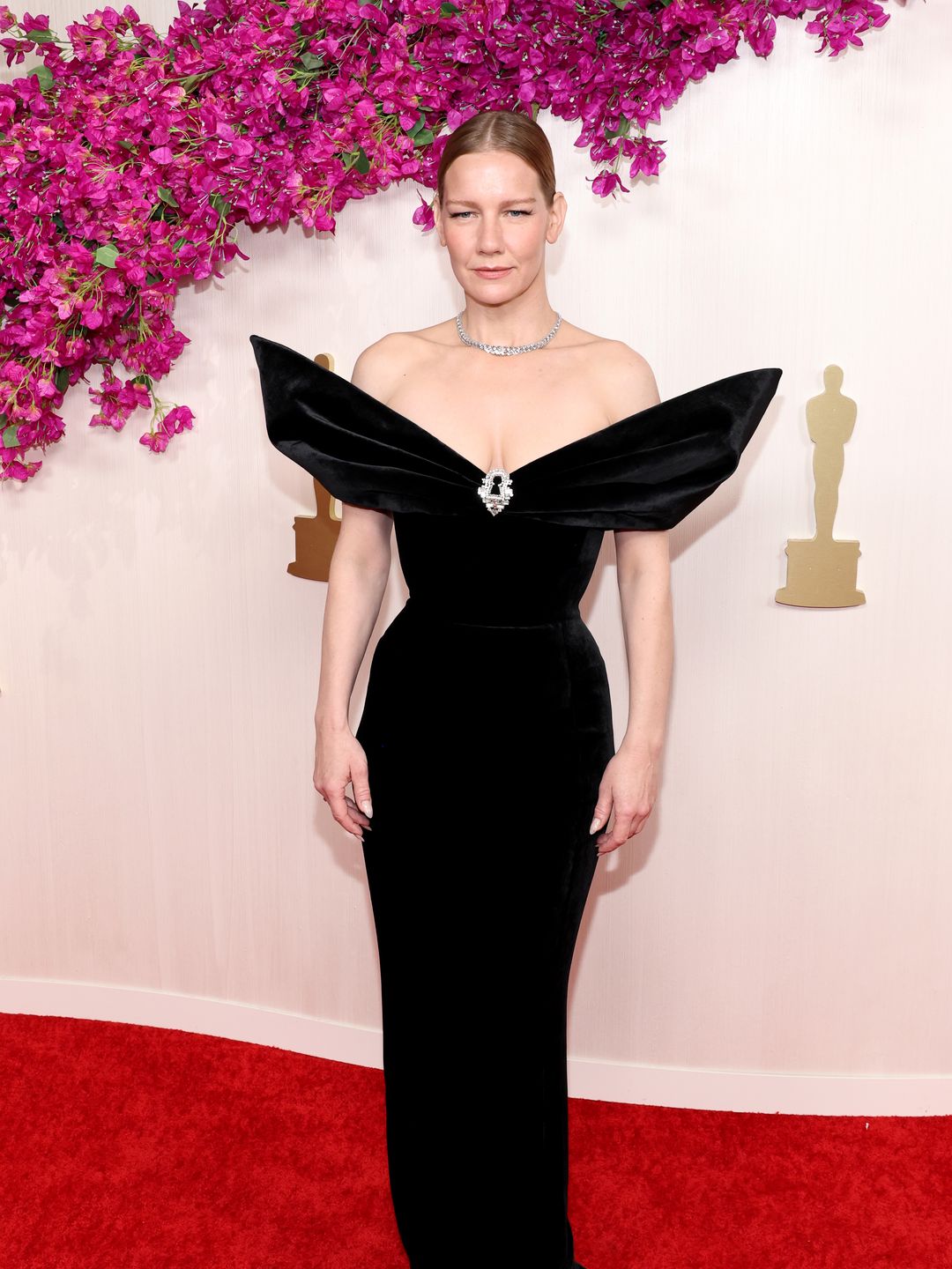 Sandra Hüller  attends the 96th Annual Academy Awards in a black gown and diamond jewellery 