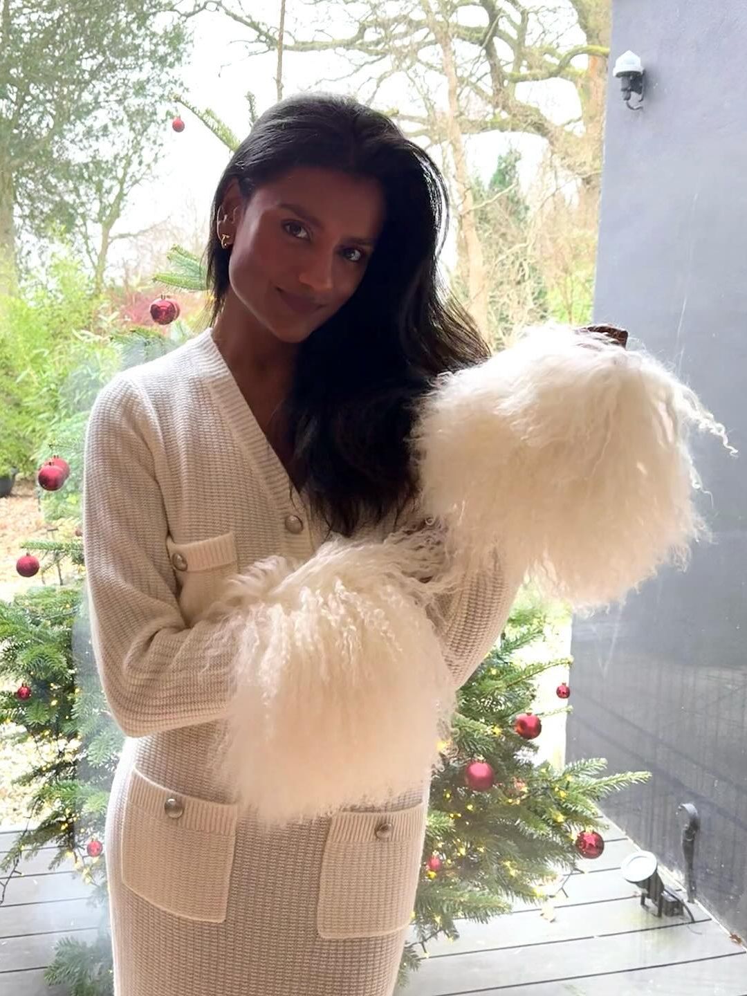 Simone Ashley poses in a white knitted set with fluffy sleeves on her Instagram