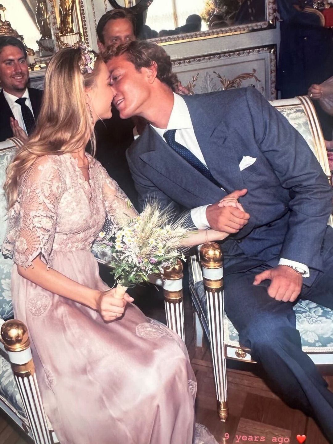 Pierre Casiraghi kissing his new wife Beatrice in a pink wedding dress