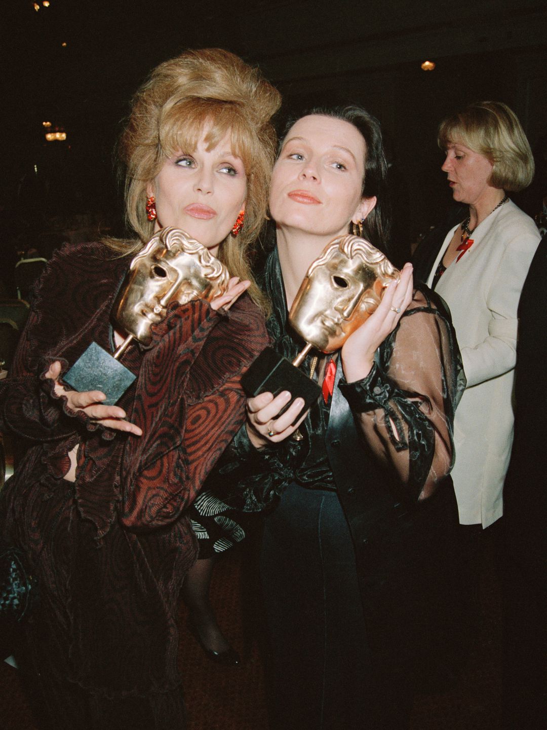 Joanna Lumley and Jennifer Saunders smiling at the BAFTAs 