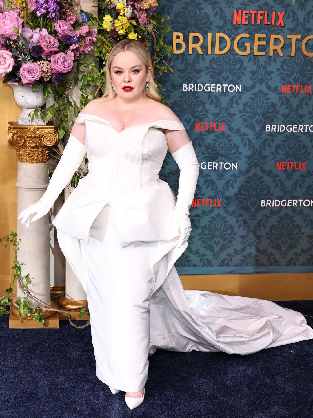 Nicola Coughlan attends Netflix's "Bridgerton" Season 3 World Premiere at Alice Tully Hall, Lincoln Center on May 13, 2024 in New York City in a white dress