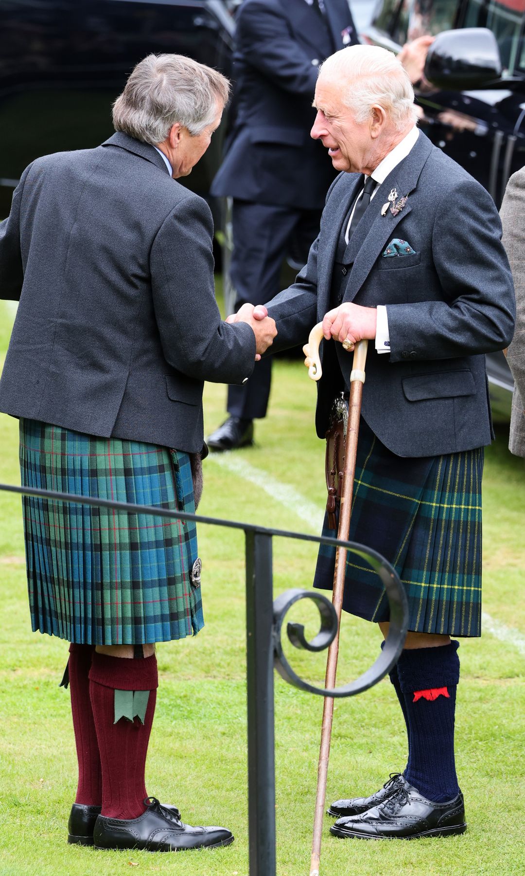 King Charles shaking hands with a man