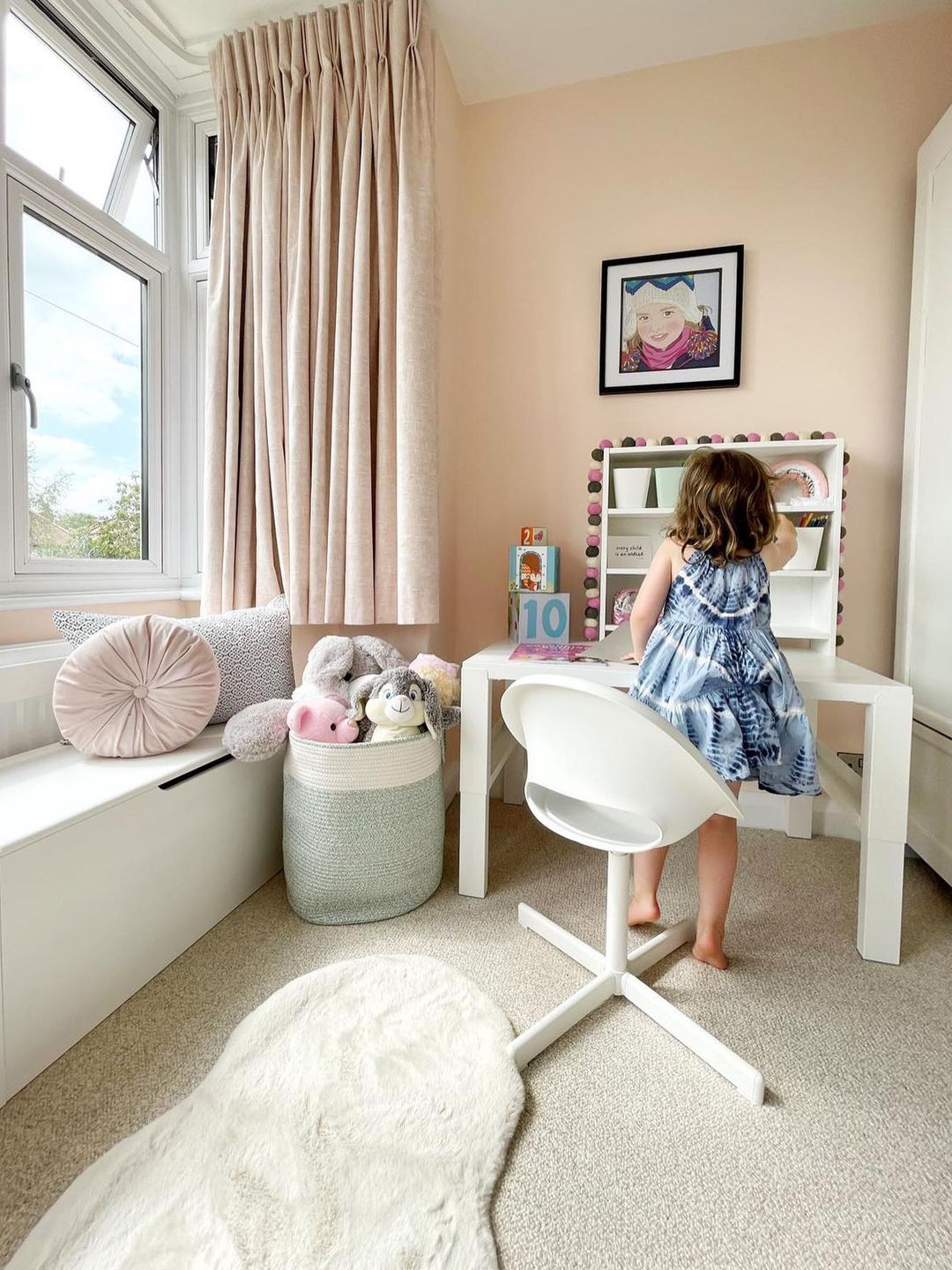 young girl at white desk 