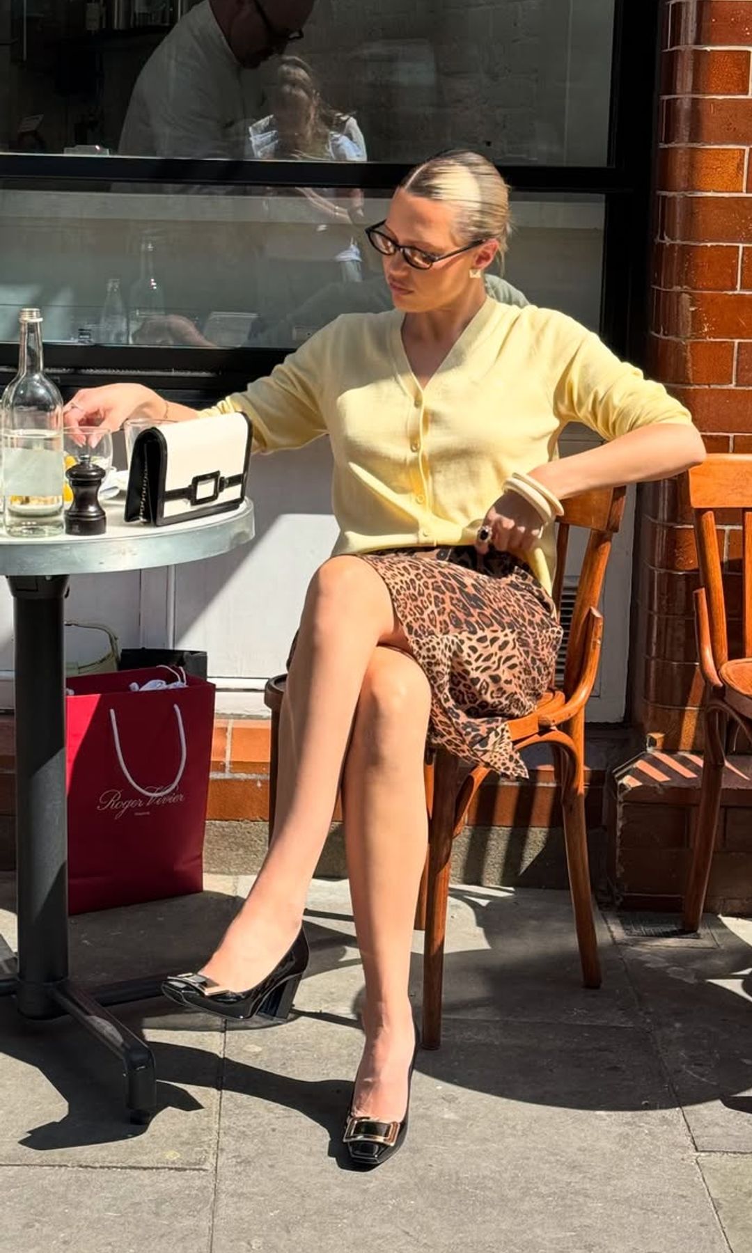 @carolineebo in yellow cardigan and pumps