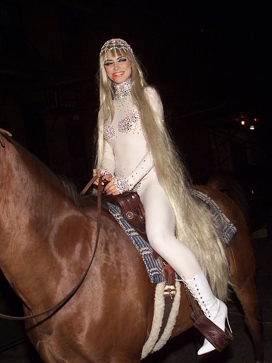 Heidi Klum riding a horse dressed as Lady Godiva 