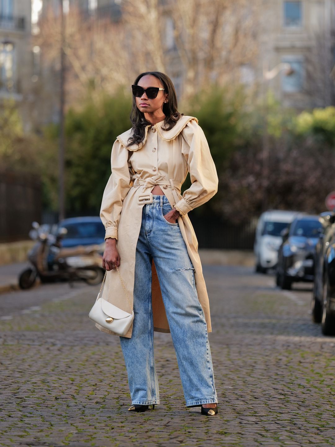 Woman wearing a trench coat with jeans 