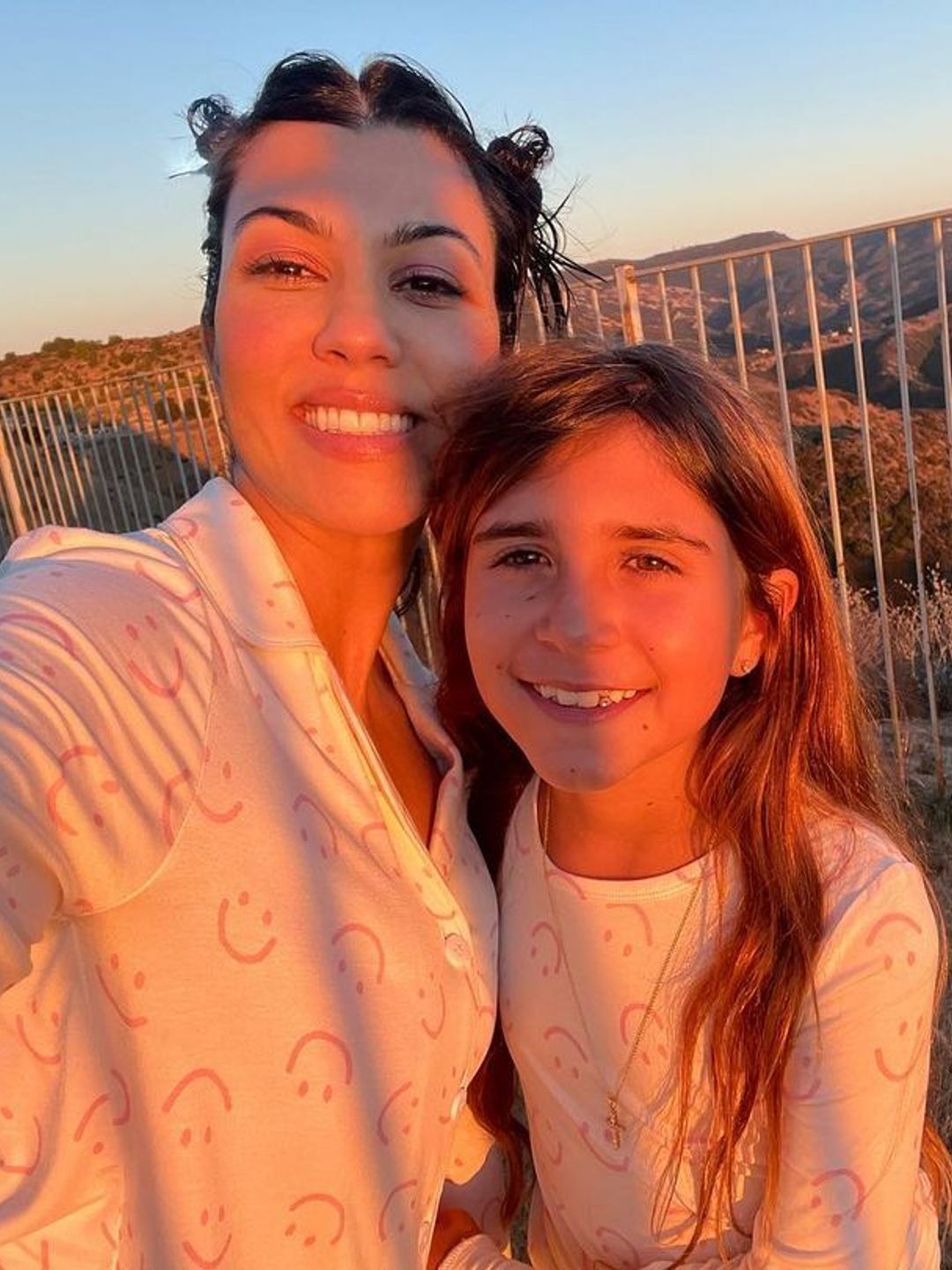 Kourtney with her daughter Penelope posing for a selfie at dawn