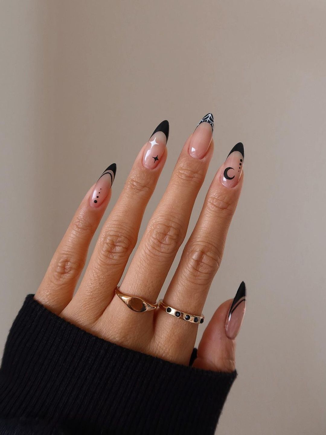 Nails with black tips and moon and stars art