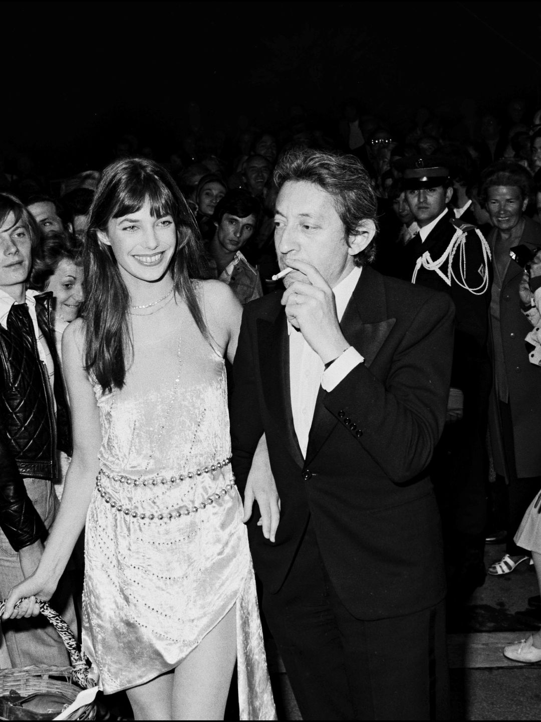 Jane Birkin holding a basket with Serge Gainsbourg at a Cannes Film Festival party 