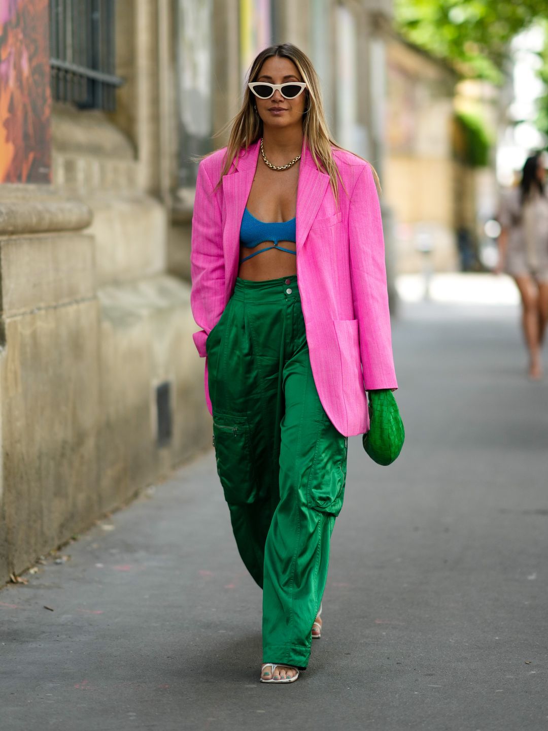 A Paris Fashion Week guest sports a pink linen blazer
