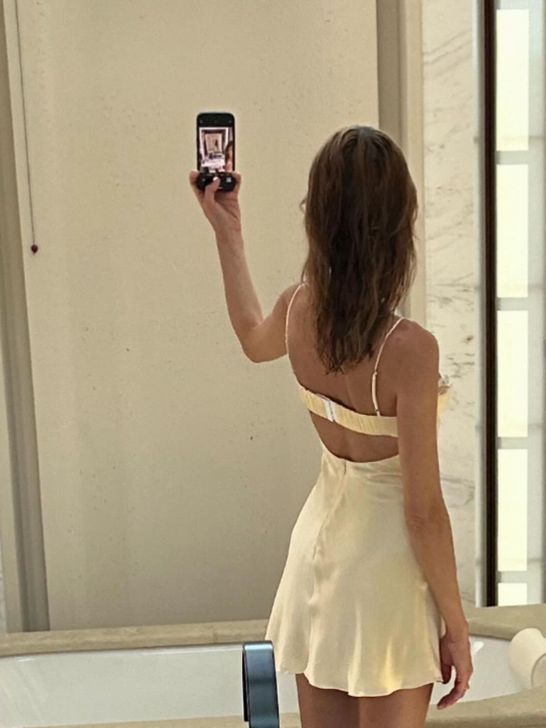 Alexa Chung shares an image of the back of her dress