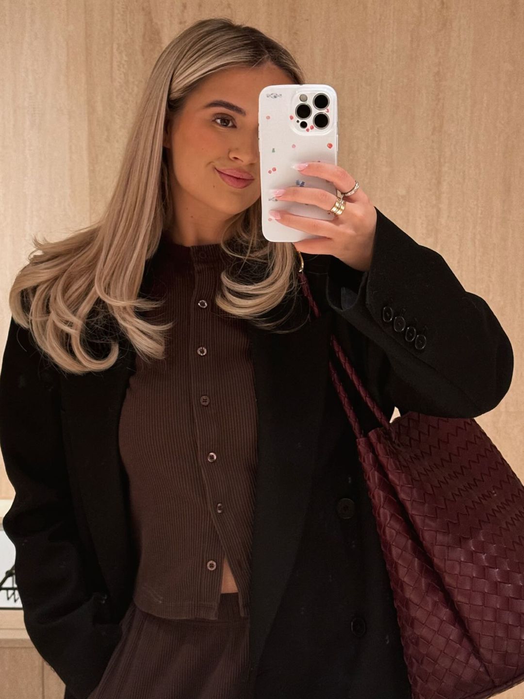 Molly-Mae Hague takes a mirror selfie in a brown outfit