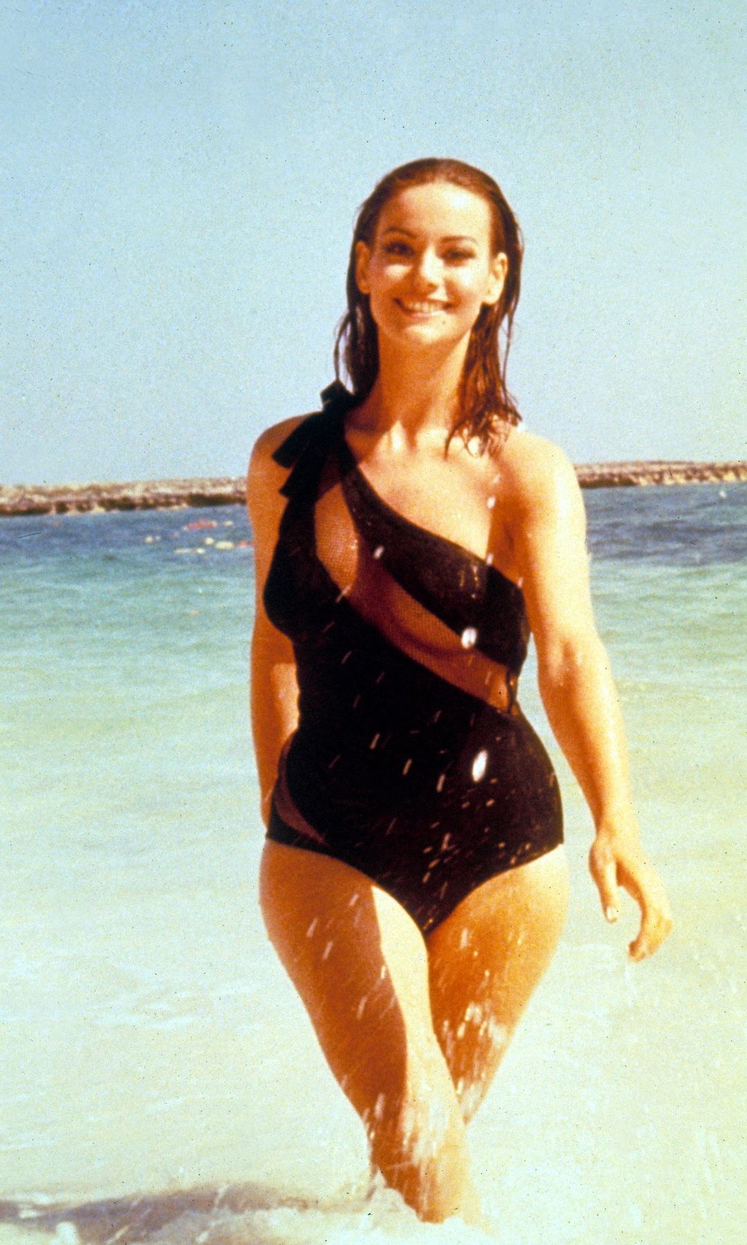 Claudine Auger in a black swimsuit as Domino Derval in Thunderball