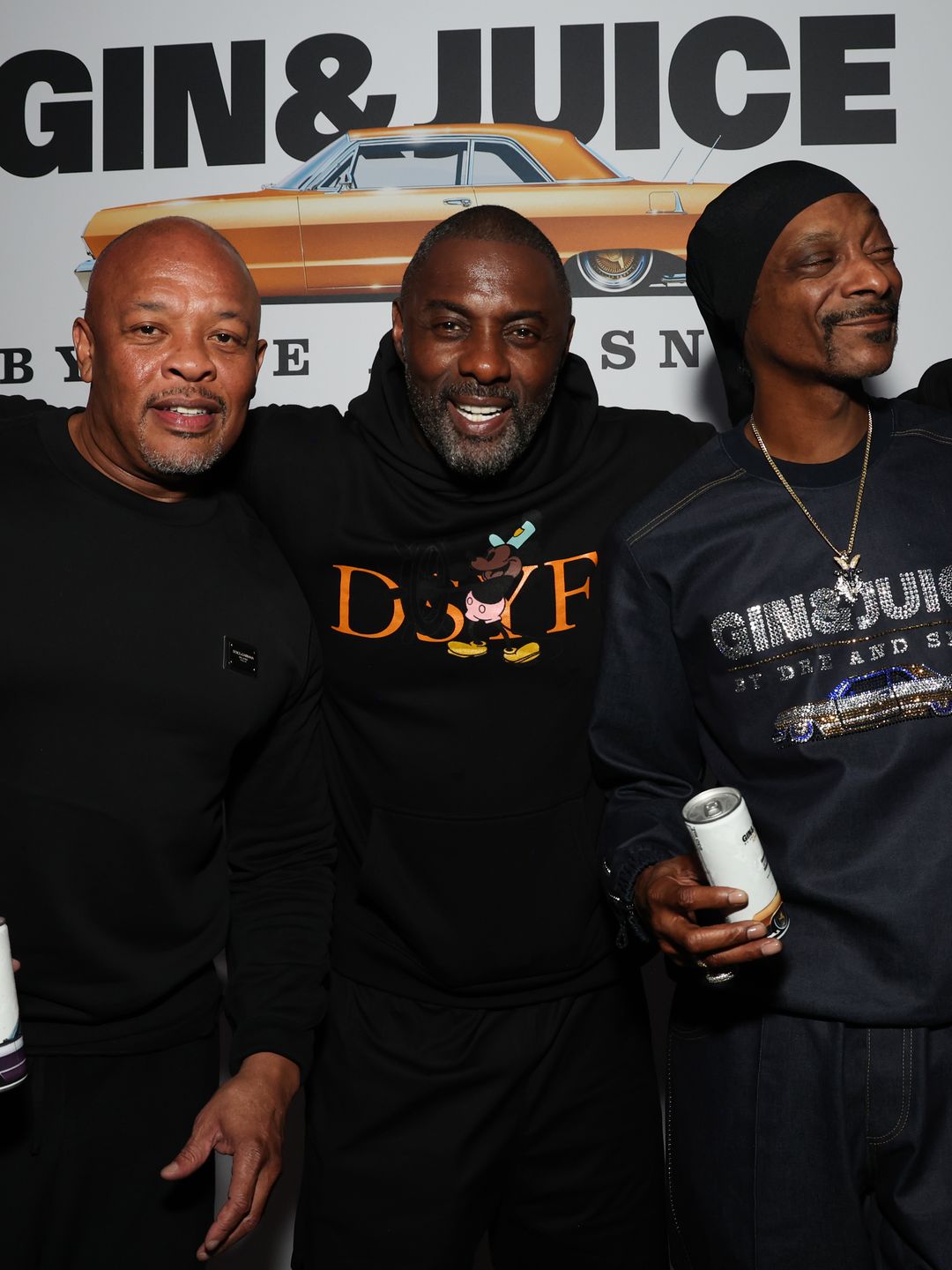 Dr. Dre, Idris Elba and Snoop Dogg  a seen backstage at the UK Launch of 'Gin & Juice By Dre and Snoop' at Flipper's Roller Boogie Palace on July 18, 2024 in London, England. (Photo by Kevin Mazur/Getty Images for Flipper's)