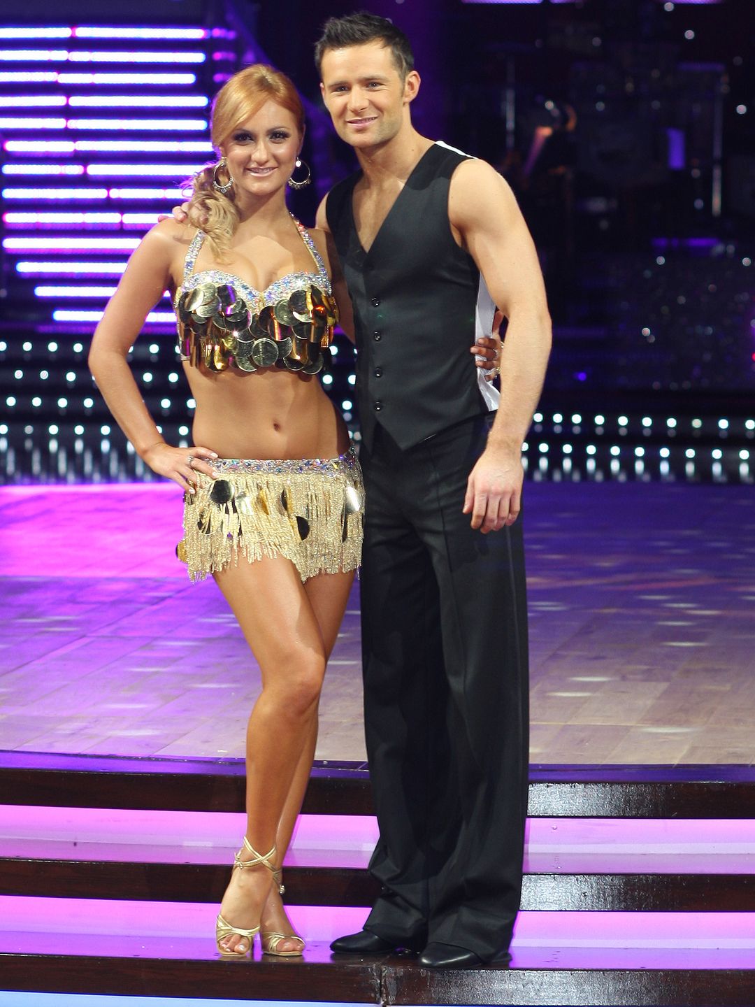 Aliona Vilani standing with Harry Judd