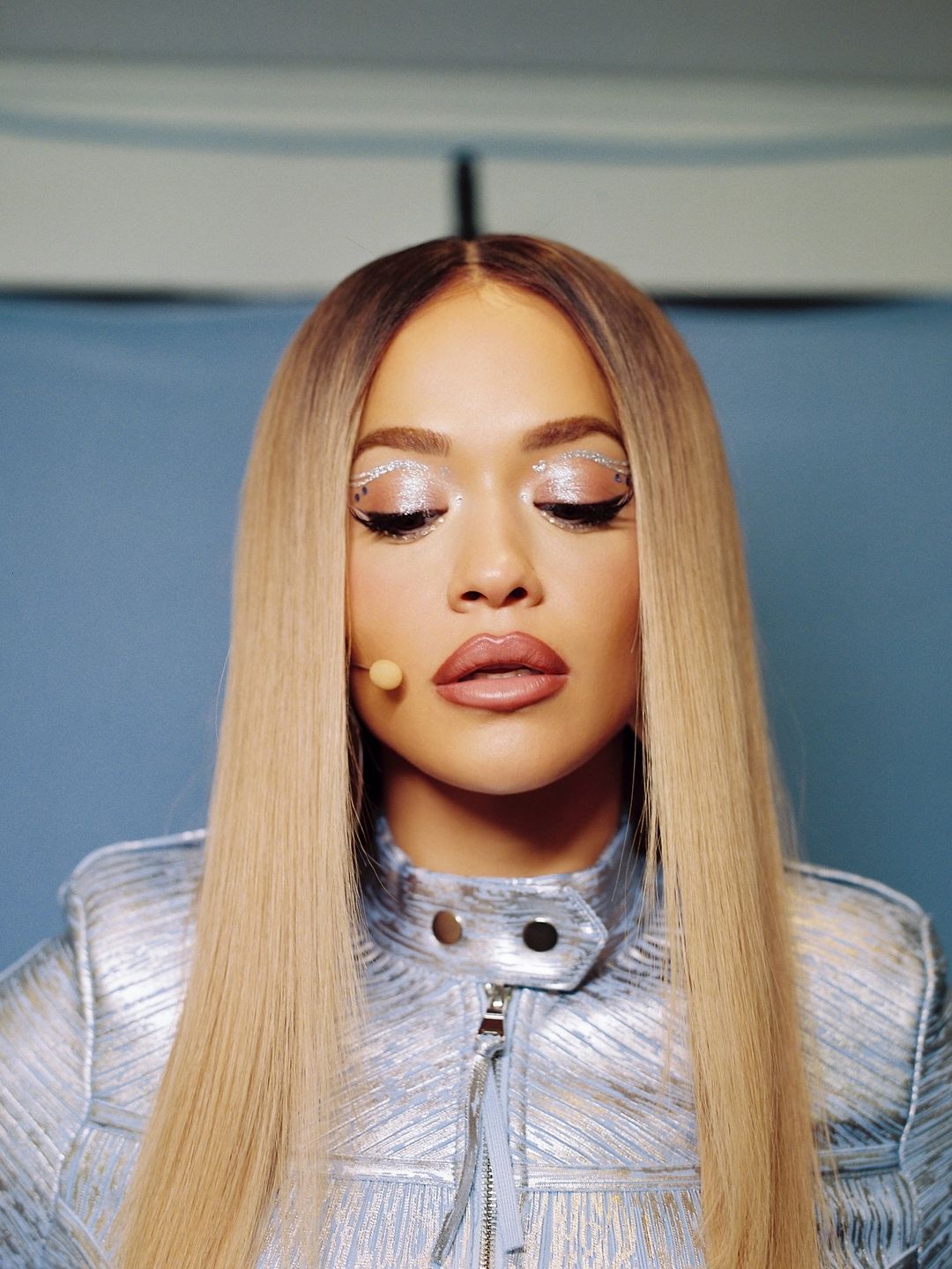 Rita Ora poses in silver makeup created by her go-to makeup artist Chloe Schlossmann 