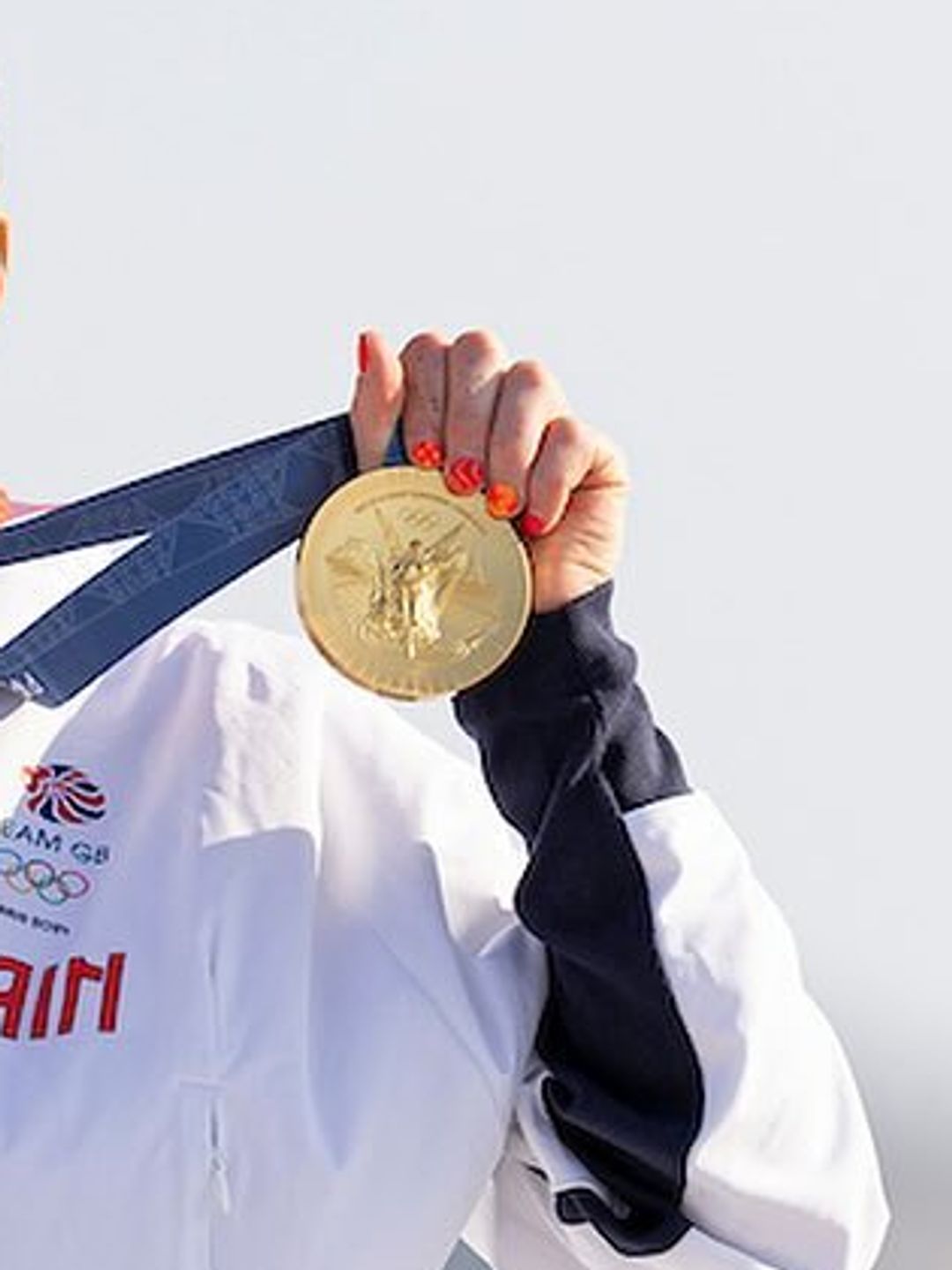 She sported a bright orange manicure for the event