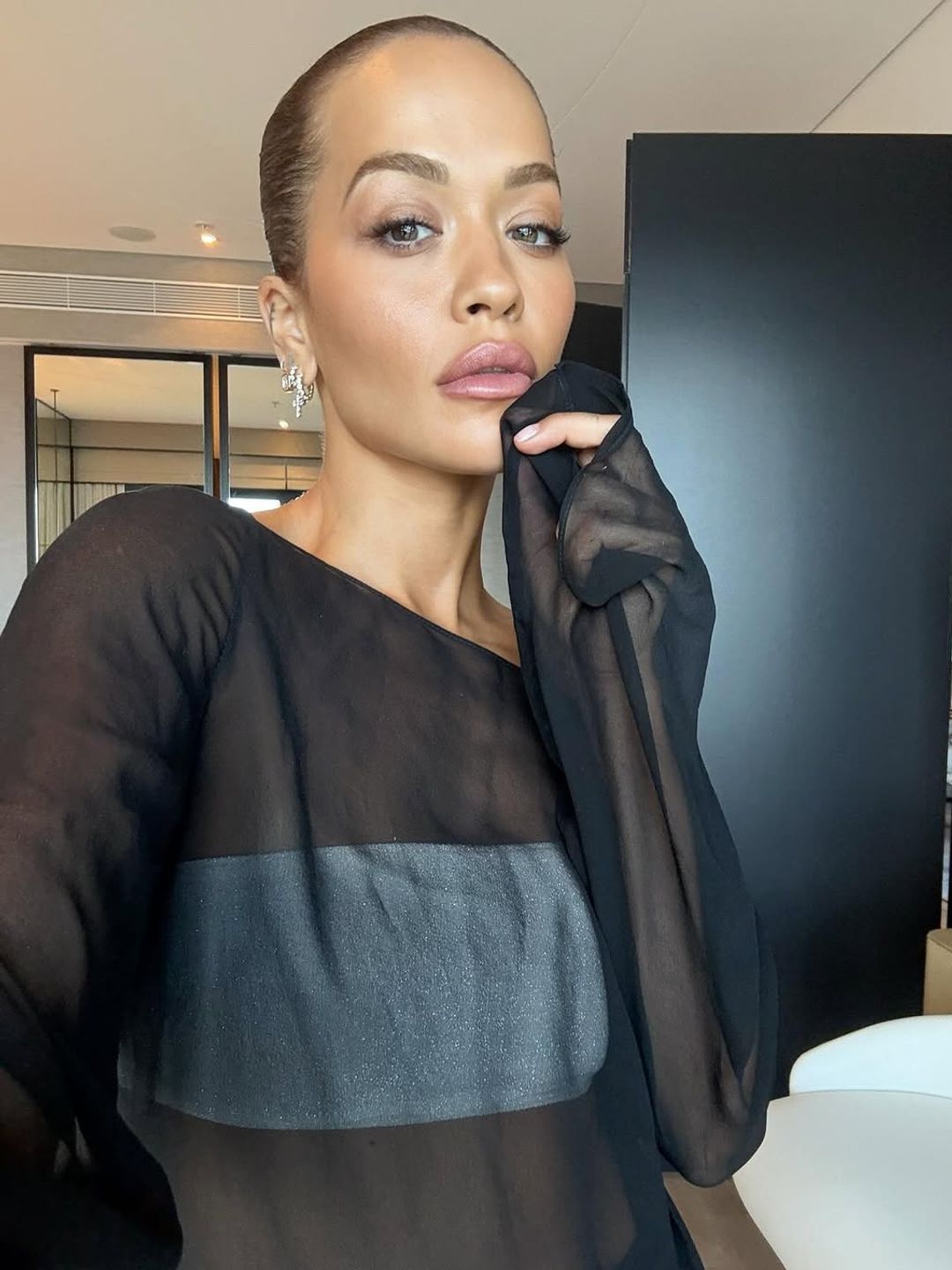 Rita Ora perfects the slicked back bun hairdo