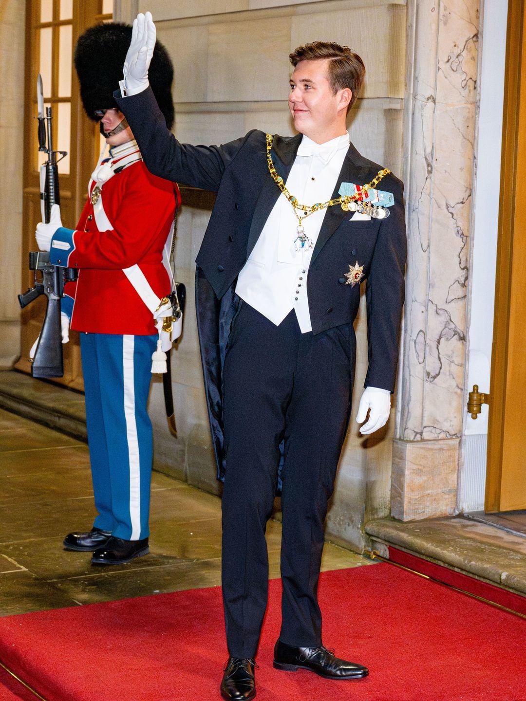 danish royal waving in white tie 