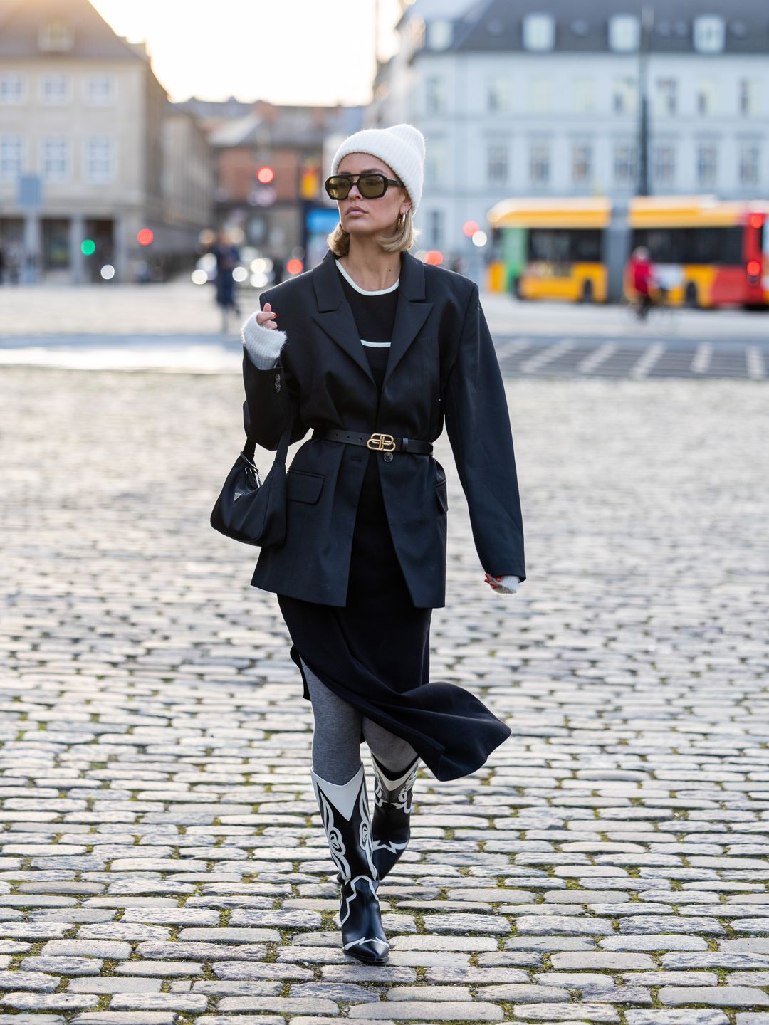Julia Kammerer styles a belted blazer with black and white cowboy boots 