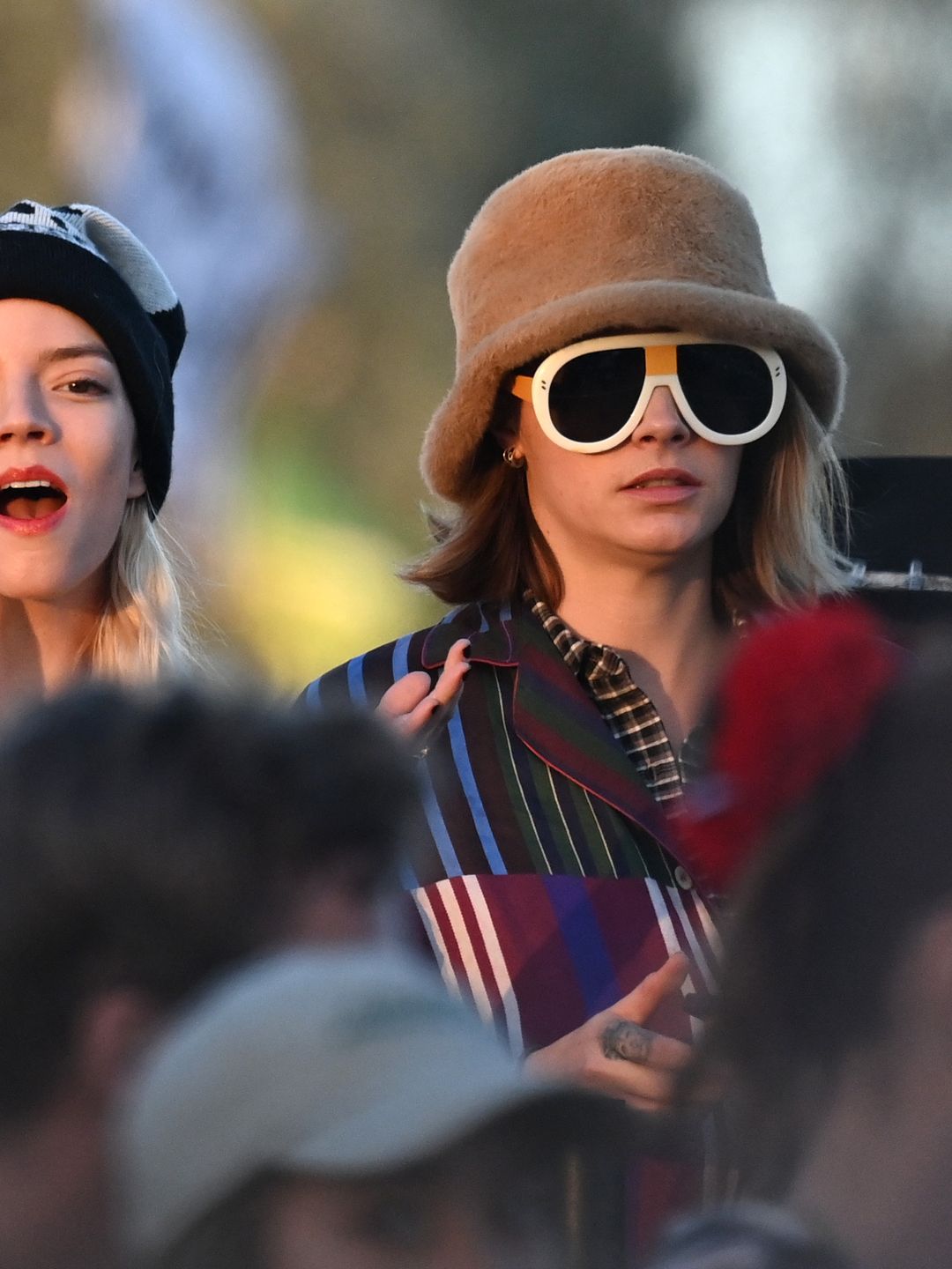 Cara Delevingne wore a fuzzy bucket hat and Loewe sunglasses during Day five of Glastonbury.