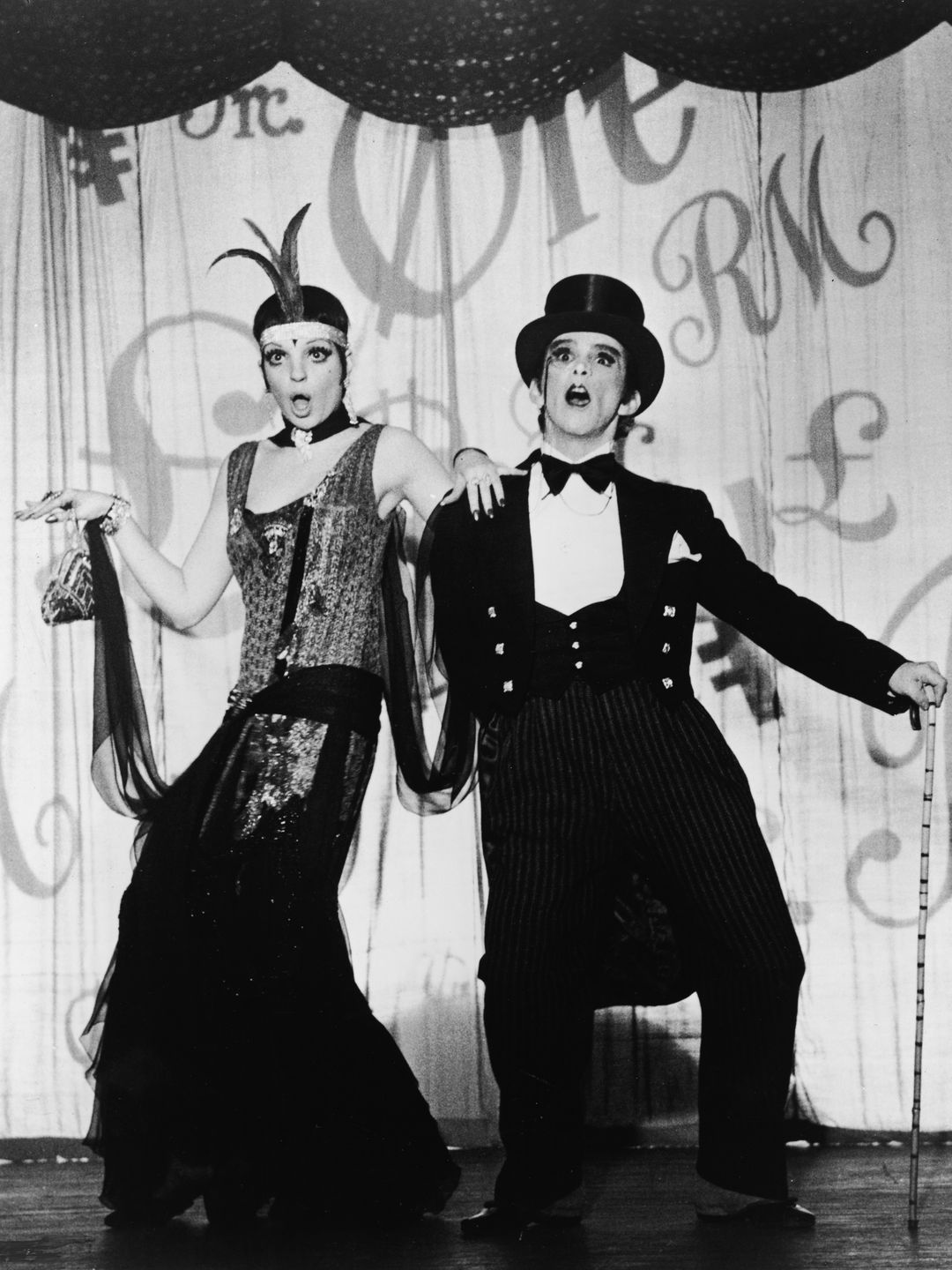 Liza Minnelli and Joel Grey perform on stage as nightclub performers in Germany during the Weimar Republic in the film version of the Broadway musical 'Cabaret' directed by Bob Fosse, 1972.