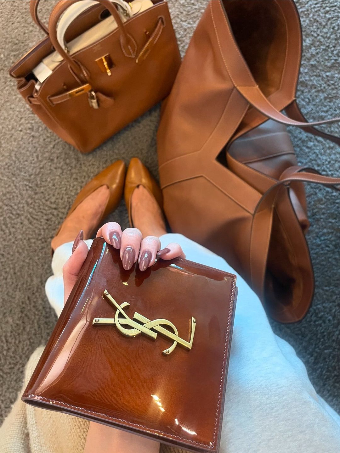 Elsa Hosk shares a close up image of her brown designer bags on Instagram